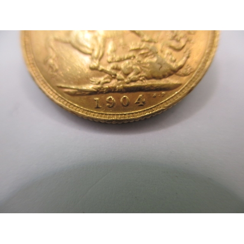 111 - An Edward VII full gold sovereign dated 1904, a circulated coin with fine definition of features