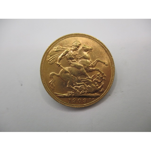 An Edward VII full gold sovereign dated 1909, a circulated coin with very fine definition of features