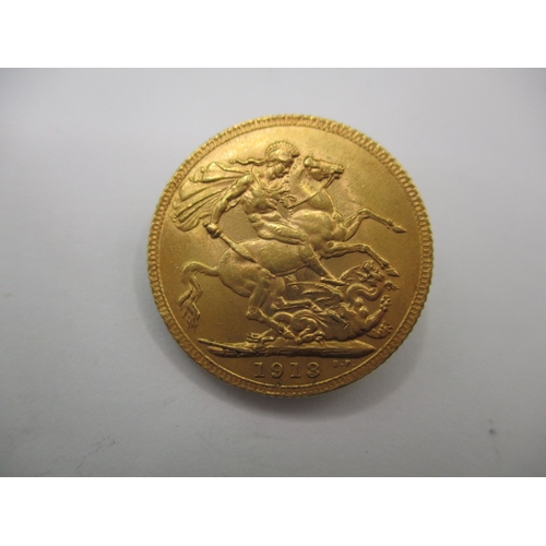 117 - A George V full gold sovereign dated 1913, a circulated coin with very fine definition of features