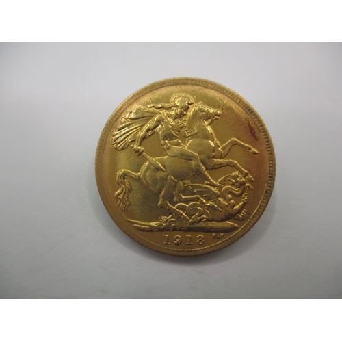 119 - A George V full gold sovereign dated 1913, a circulated coin with fine definition of features