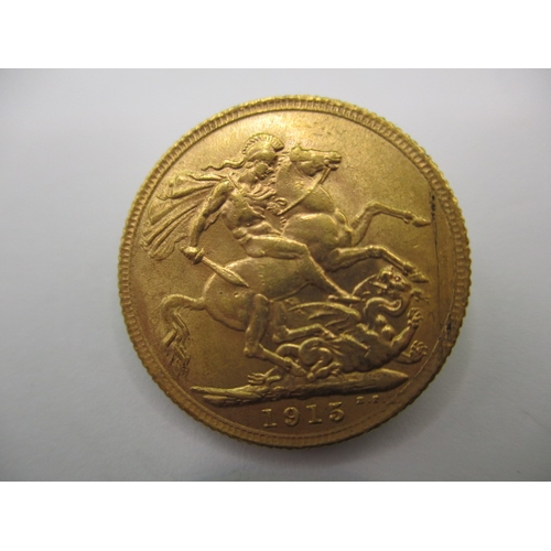 120 - A George V full gold sovereign dated 1915, a circulated coin with very fine definition of features, ... 