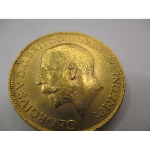 125 - A George V full gold sovereign dated 1927, a circulated coin with very fine definition of features