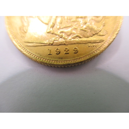 126 - A George V full gold sovereign dated 1929, a near uncirculated coin with very fine definition of fea... 