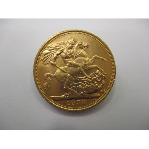 128 - An Elizabeth II  full gold sovereign dated 1958, a circulated coin with very fine definition of feat... 