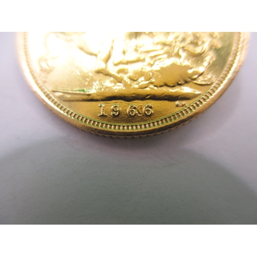 129 - An Elizabeth II  full gold sovereign dated 1966, a circulated coin with very fine definition of feat... 