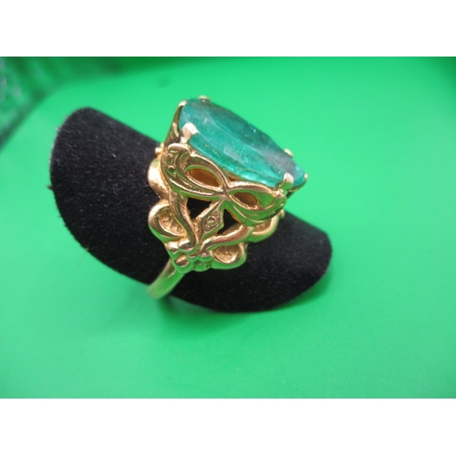 6 - An Asian yellow gold ring with large central green stone, approx. ring size ‘M+’, approx. gross weig... 