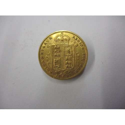 140 - A Victorian gold half sovereign dated 1892, having shield back, a circulated coin with fine definiti... 