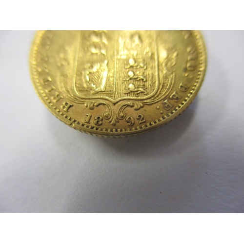 140 - A Victorian gold half sovereign dated 1892, having shield back, a circulated coin with fine definiti... 