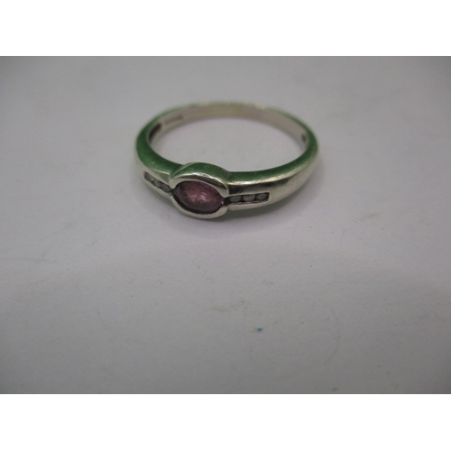 18 - A 9ct white gold and pink sapphire dress ring, approx. ring size ‘Q’ approx. weight 2.1g in useable ... 