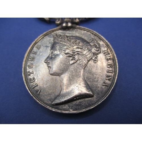 254 - A Victorian Baltic medal with original ribbon, un-named and with general age-related marks