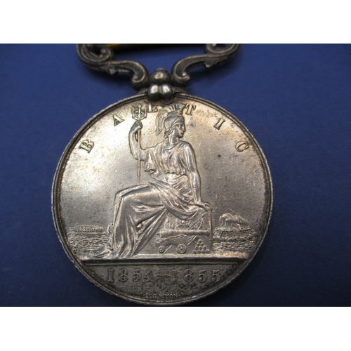 254 - A Victorian Baltic medal with original ribbon, un-named and with general age-related marks