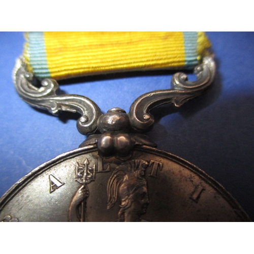 254 - A Victorian Baltic medal with original ribbon, un-named and with general age-related marks