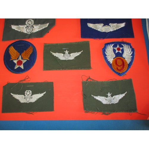 258 - A parcel of military metal and cloth badges, and a 1945 Lancaster 1/111 handling drills booklet, all... 