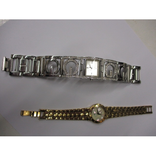 82 - Two designer watches, one by Gucci the other Guess, provenanced by vendor as originally being purcha... 