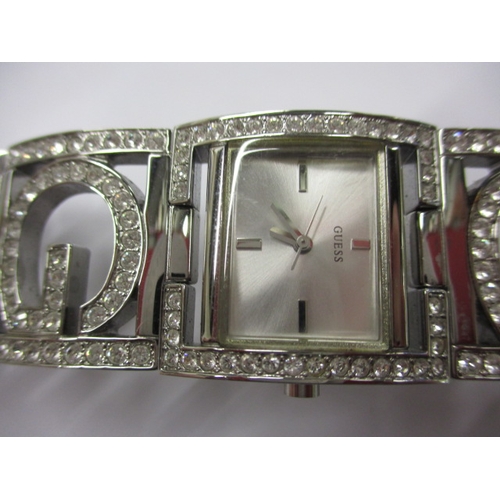 82 - Two designer watches, one by Gucci the other Guess, provenanced by vendor as originally being purcha... 