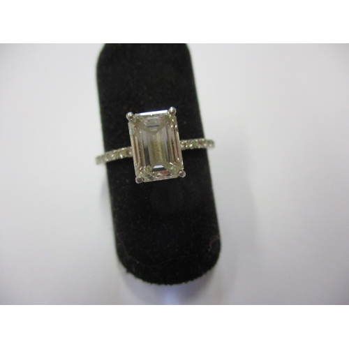 43 - Foreign mark, tested as platinum and diamond ring, the central emerald cut stone being 1.5ct colour ... 