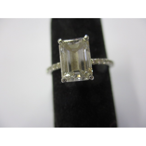 43 - Foreign mark, tested as platinum and diamond ring, the central emerald cut stone being 1.5ct colour ... 