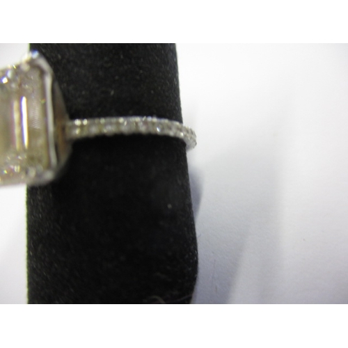 43 - Foreign mark, tested as platinum and diamond ring, the central emerald cut stone being 1.5ct colour ... 