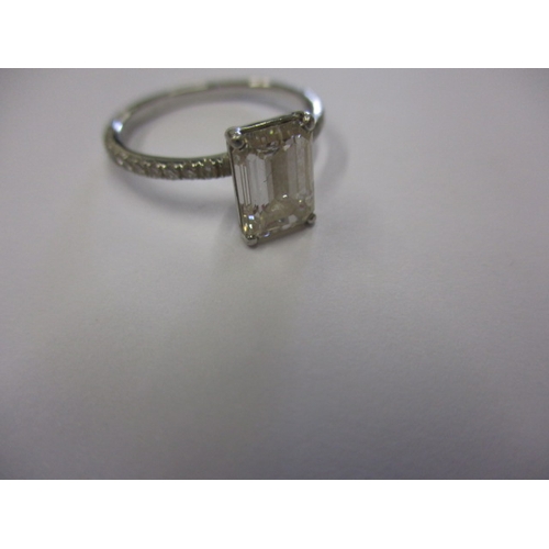 43 - Foreign mark, tested as platinum and diamond ring, the central emerald cut stone being 1.5ct colour ... 