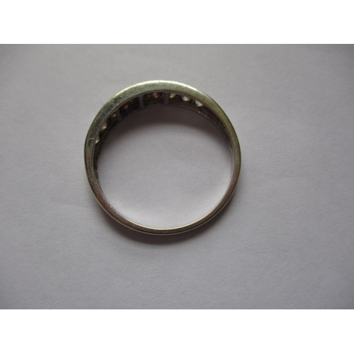 21 - A 9ct white gold and CZ half eternity ring, approx. ring size ‘V’, approx. weight 2.6g in useable pr... 