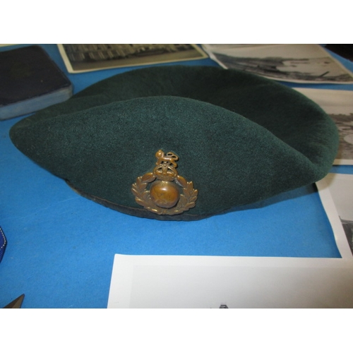 261 - A parcel of WWII Royal Marines items, to include a Kangol green beret with badge, a trio of medals a... 