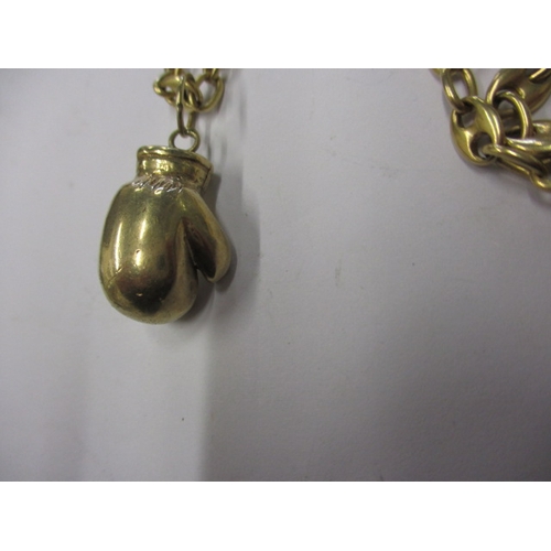 53 - A gold necklace chain with boxing glove pendant, pendant marked for 9ct the chain un-marked but beli... 