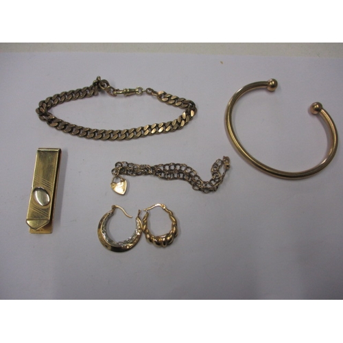 70 - A parcel of gold and yellow metal items, to include an 18ct tie clip, approx. weights 11.8g 18ct, 29... 