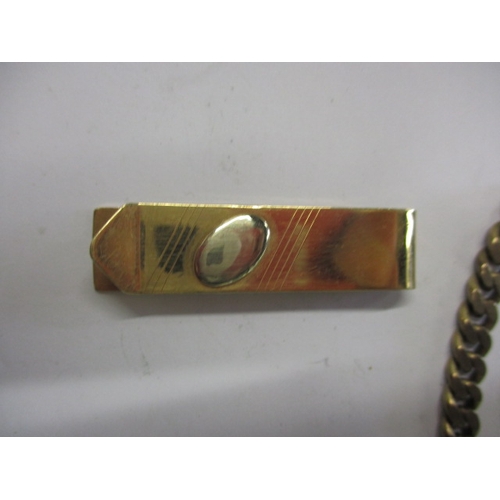 70 - A parcel of gold and yellow metal items, to include an 18ct tie clip, approx. weights 11.8g 18ct, 29... 