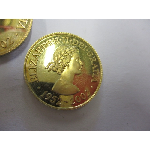 150 - Three 2002 Queens golden jubilee commemorative coins, believed to be 9ct gold and each weighing appr... 