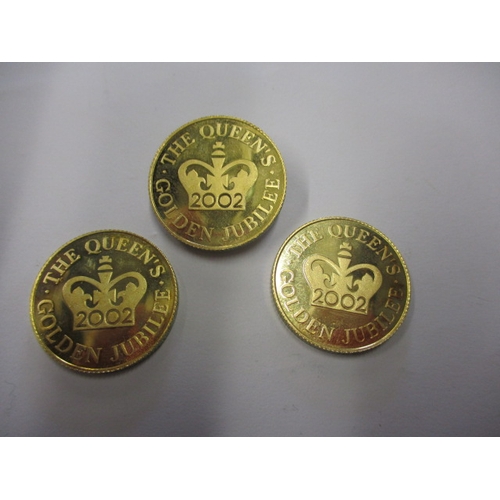 150 - Three 2002 Queens golden jubilee commemorative coins, believed to be 9ct gold and each weighing appr... 