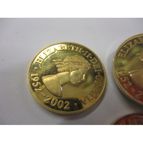 151 - Three 2002 Queens golden jubilee commemorative coins, believed to be 9ct gold and each weighing appr... 