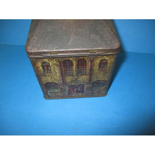 250 - A vintage biscuit tin in the form of a bank money box, having reasonable amount of decoration and or... 