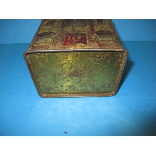 250 - A vintage biscuit tin in the form of a bank money box, having reasonable amount of decoration and or... 