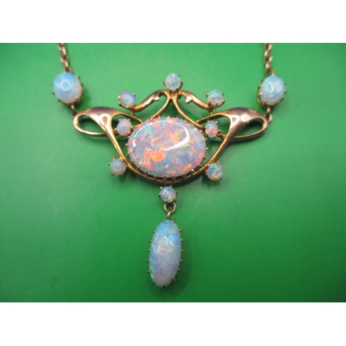 56 - A late 19th century 15ct gold and opal necklace, having 12 fire opals, the central stone measuring a... 