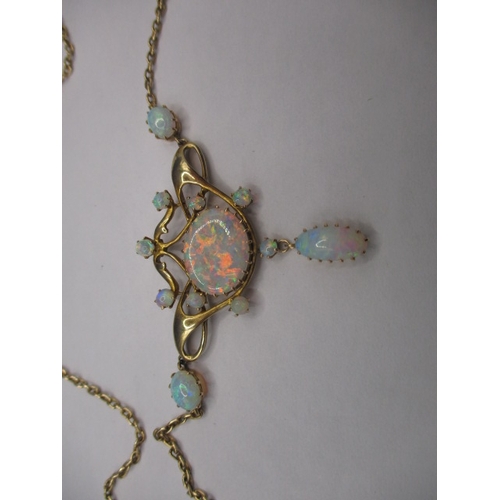 56 - A late 19th century 15ct gold and opal necklace, having 12 fire opals, the central stone measuring a... 