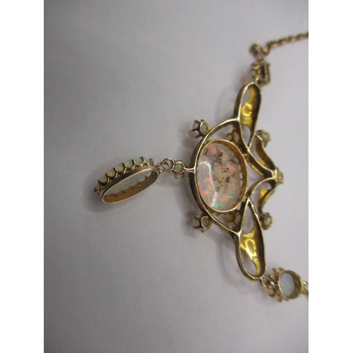 56 - A late 19th century 15ct gold and opal necklace, having 12 fire opals, the central stone measuring a... 