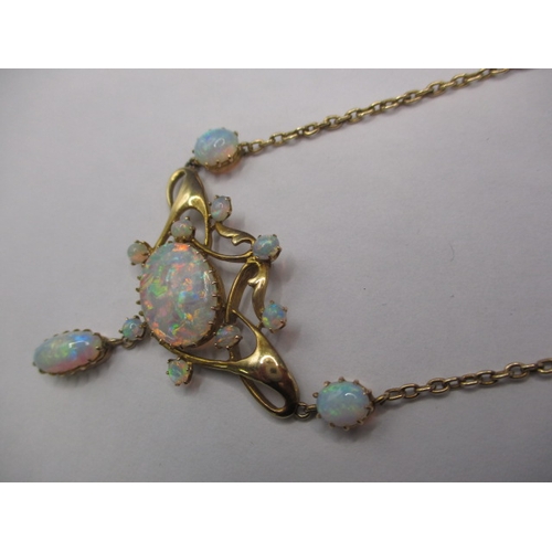 56 - A late 19th century 15ct gold and opal necklace, having 12 fire opals, the central stone measuring a... 