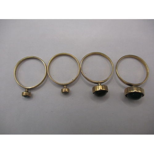 40 - A set of four 9ct gold rings, each set with a cabochon green stone of various sizes, approx. ring si... 