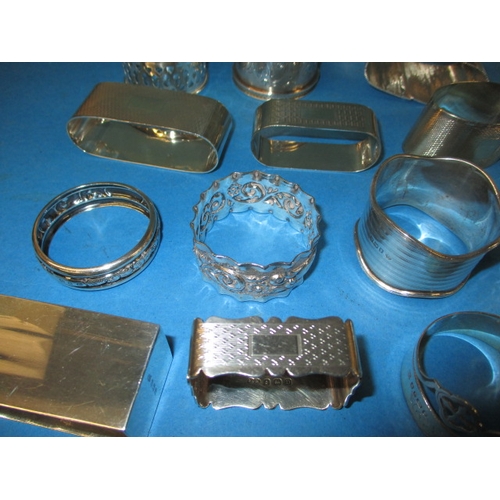 191 - A large quantity of silver and white metal napkin rings, various makers, all in used condition, appr... 