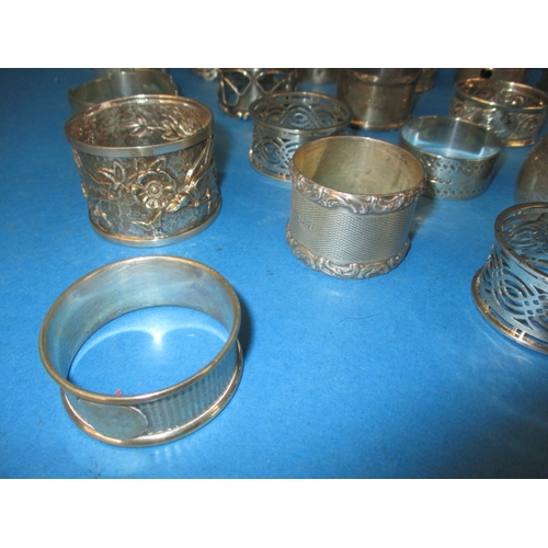 193 - A parcel of antique and later silver and white metal napkin rings, various makers and dates, all in ... 