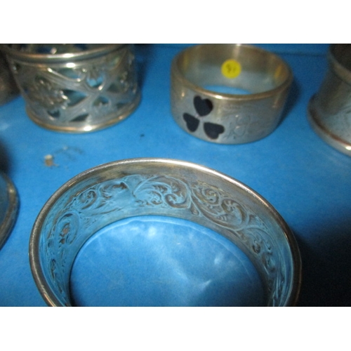 193 - A parcel of antique and later silver and white metal napkin rings, various makers and dates, all in ... 