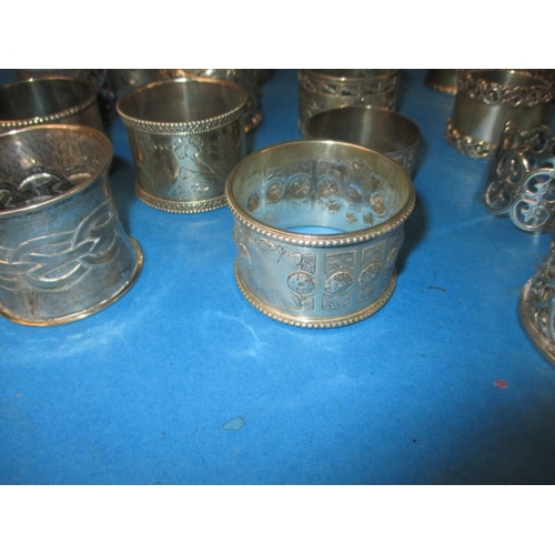 194 - A parcel of antique and later silver and white metal napkin rings, to include some enamelled example... 