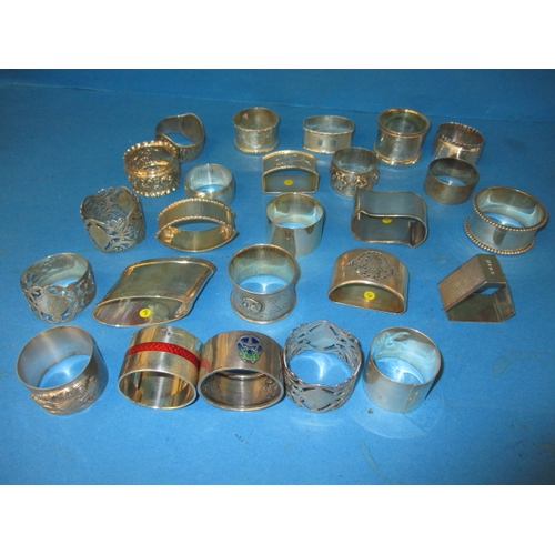 A parcel of antique and later silver and white metal napkin rings, to include some enamelled examples, various makers and dates, all in used condition, approx. gross parcel weight 845g  (B)