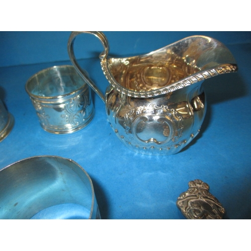 202 - A parcel of silver and white metal items, to include napkin rings and a jug, all in good used condit... 