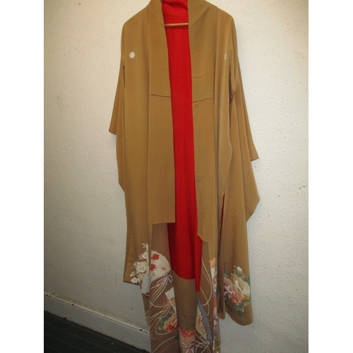 321 - A beige silk Japanese kimono, with original wrapping. In used condition with a few loose threads and... 