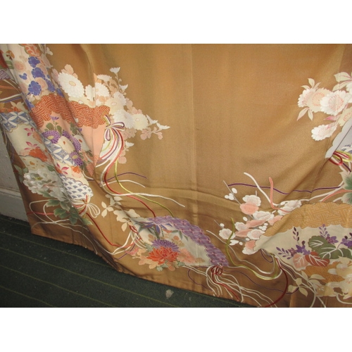 321 - A beige silk Japanese kimono, with original wrapping. In used condition with a few loose threads and... 