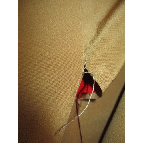 321 - A beige silk Japanese kimono, with original wrapping. In used condition with a few loose threads and... 