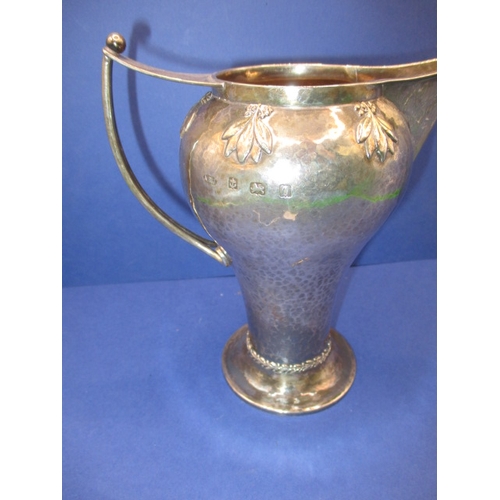 200 - An Art Nouveau sterling silver cram jug, makers mark for A E Jones, in good used condition, approx. ... 