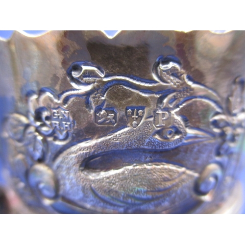 205 - An antique sterling silver cream jug, Chester Hallmark, repousse hunting scene decoration, in good u... 