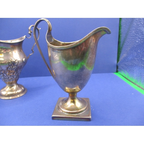 208 - A Georgian sterling silver cream jug and a later example, both in good used condition, approx. gross... 